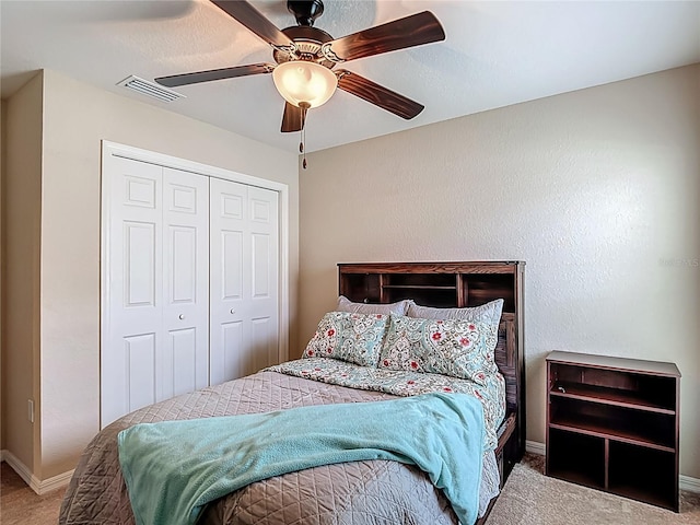 6812 Gideon Cir, Zephyrhills, FL 33541 - bedroom featuring carpet flooring, a closet, baseboards, and ceiling fan