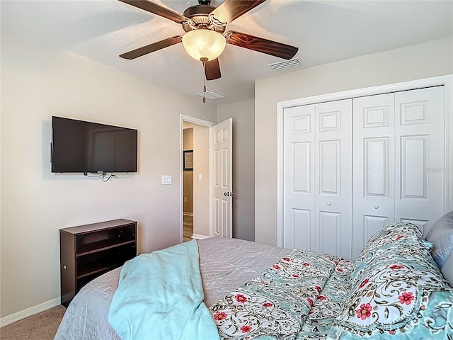 6812 Gideon Cir, Zephyrhills, FL 33541 - bedroom with carpet flooring, a closet, ceiling fan, and baseboards