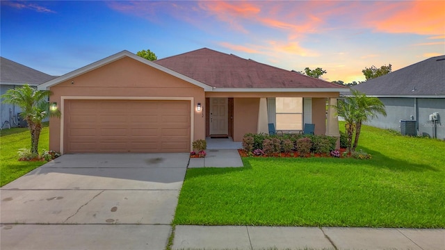 6812 Gideon Cir, Zephyrhills, FL 33541 - single story home featuring stucco siding, a lawn, concrete driveway, and a garage