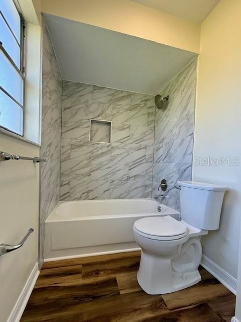 8770 SW 196th Terrace Rd, Dunnellon, FL 34432 - bathroom featuring wood finished floors, toilet, tub / shower combination, and baseboards