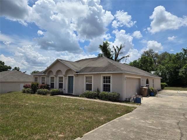 4460 SW 44th St, Ocala, FL 34474 - ranch-style house featuring a garage, stucco siding, driveway, and a front lawn