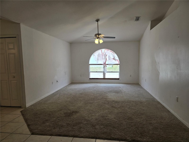 4460 SW 44th St, Ocala, FL 34474 - empty room featuring a ceiling fan, light carpet, lofted ceiling, baseboards, and light tile patterned floors