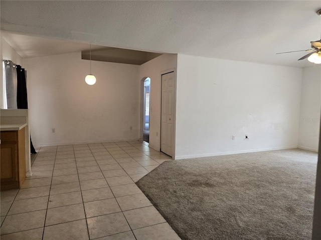 4460 SW 44th St, Ocala, FL 34474 - unfurnished room with ceiling fan, arched walkways, light tile patterned floors, and baseboards