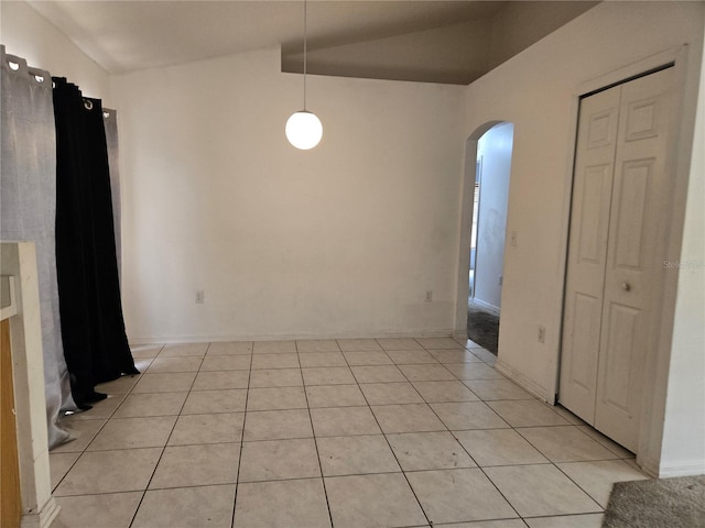 4460 SW 44th St, Ocala, FL 34474 - empty room with arched walkways, light tile patterned flooring, and lofted ceiling