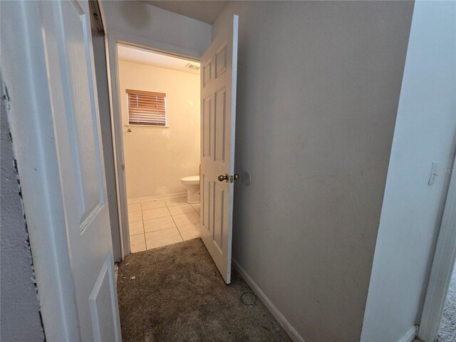 4460 SW 44th St, Ocala, FL 34474 - corridor featuring carpet flooring, tile patterned flooring, and baseboards