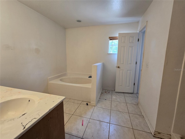 4460 SW 44th St, Ocala, FL 34474 - full bathroom featuring a bath, vanity, tile patterned flooring, and baseboards