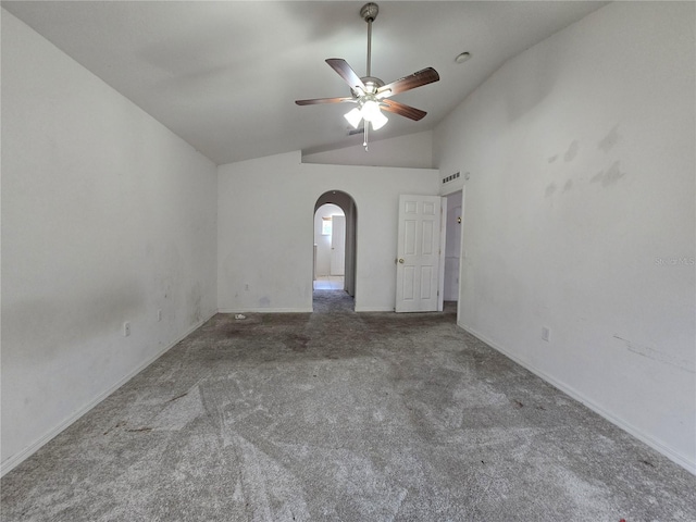 4460 SW 44th St, Ocala, FL 34474 - carpeted spare room featuring lofted ceiling, arched walkways, a ceiling fan, and baseboards