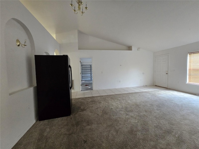 4460 SW 44th St, Ocala, FL 34474 - carpeted empty room with vaulted ceiling, a chandelier, and tile patterned floors