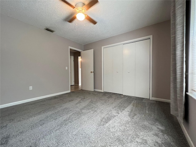 21 Pecan Course Cir, Ocala, FL 34472 - unfurnished bedroom with carpet, a textured ceiling, baseboards, a closet, and ceiling fan