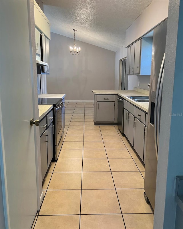 21 Pecan Course Cir, Ocala, FL 34472 - kitchen featuring stainless steel appliances, a peninsula, gray cabinetry, a chandelier, and light countertops