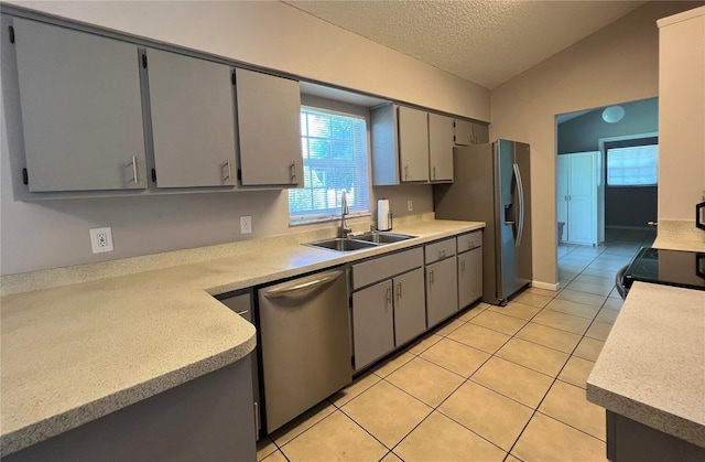 21 Pecan Course Cir, Ocala, FL 34472 - kitchen featuring stainless steel appliances, a sink, a textured ceiling, light tile patterned floors, and gray cabinets