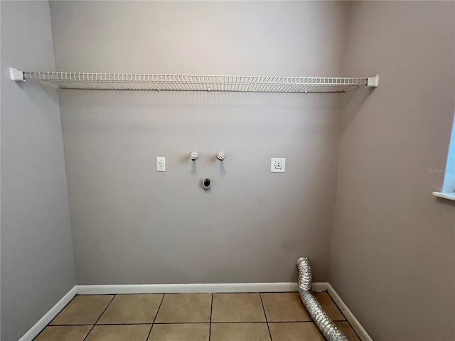 21 Pecan Course Cir, Ocala, FL 34472 - laundry room featuring electric dryer hookup, hookup for a gas dryer, baseboards, light tile patterned floors, and washer hookup