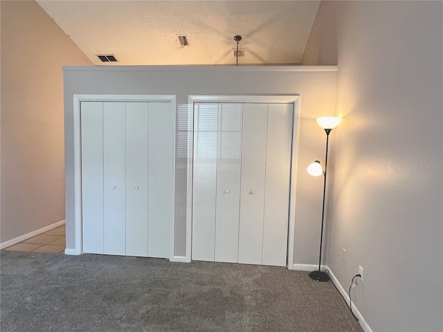 21 Pecan Course Cir, Ocala, FL 34472 - unfurnished bedroom featuring carpet floors, two closets, and baseboards