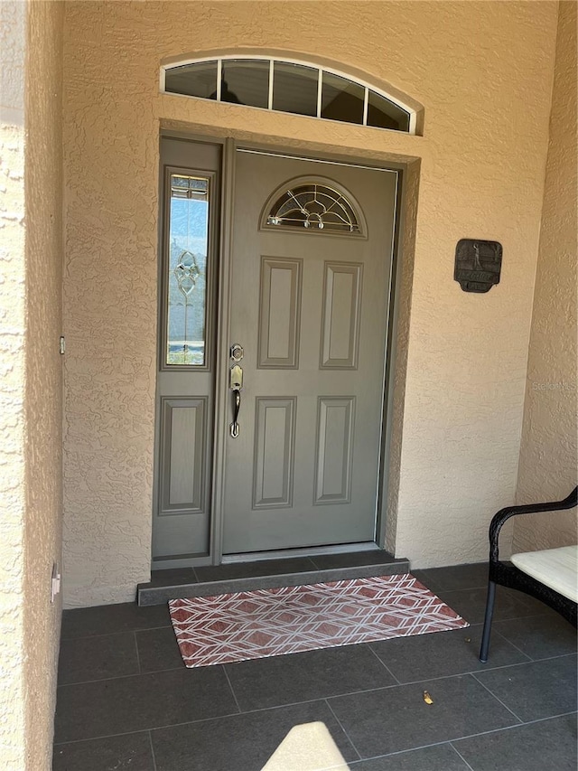 8447 SW 82nd Loop, Ocala, FL 34481 - property entrance with stucco siding