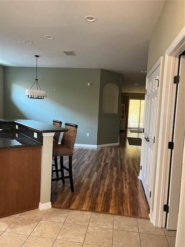 8447 SW 82nd Loop, Ocala, FL 34481 - kitchen with light tile patterned flooring, recessed lighting, baseboards, and pendant lighting