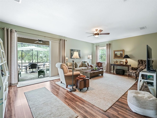 8447 SW 82nd Loop, Ocala, FL 34481 - living room with a ceiling fan and wood finished floors