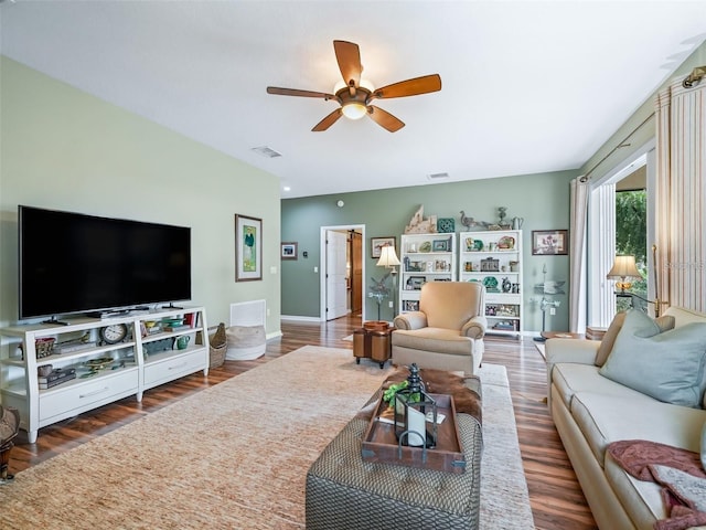 8447 SW 82nd Loop, Ocala, FL 34481 - living area featuring a ceiling fan, wood finished floors, and baseboards