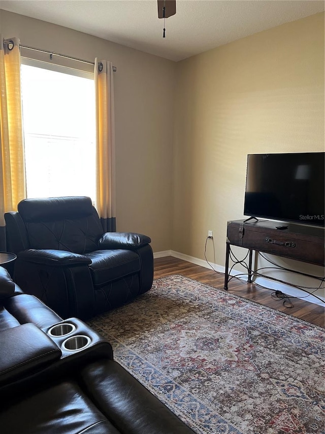 8447 SW 82nd Loop, Ocala, FL 34481 - living area with wood finished floors, baseboards, and a ceiling fan