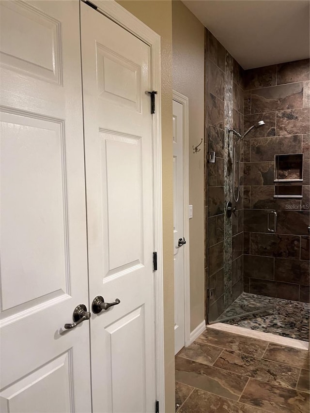 8447 SW 82nd Loop, Ocala, FL 34481 - bathroom with a stall shower and baseboards
