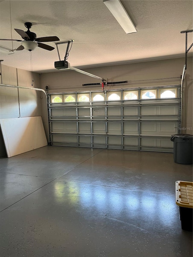 8447 SW 82nd Loop, Ocala, FL 34481 - garage featuring a garage door opener and a ceiling fan