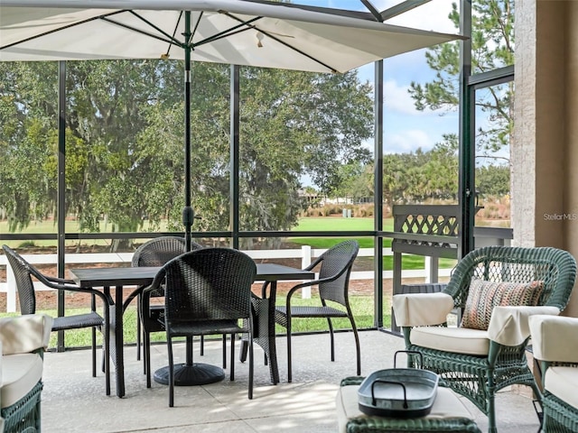 8447 SW 82nd Loop, Ocala, FL 34481 - sunroom / solarium featuring outdoor dining area