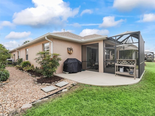 8447 SW 82nd Loop, Ocala, FL 34481 - rear view of house featuring stucco siding, a patio area, a lawn, glass enclosure, and roof with shingles