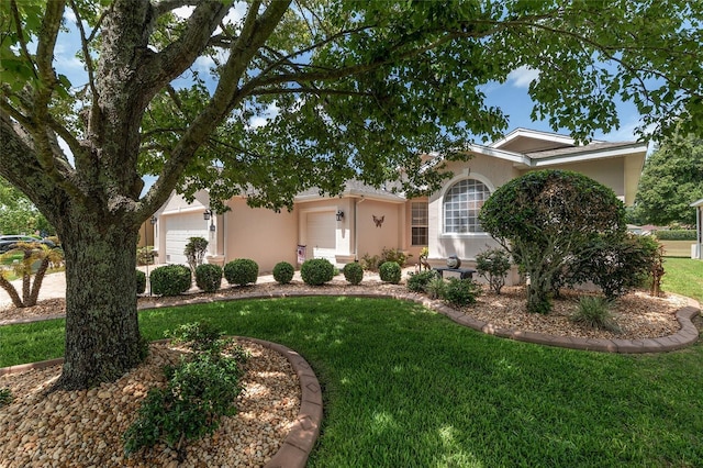1748 SW 157th Place Rd, Ocala, FL 34473 - view of front of property with stucco siding, a garage, and a front yard