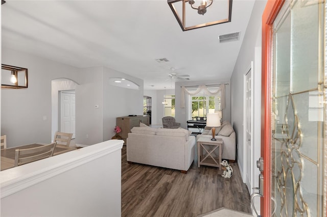 1748 SW 157th Place Rd, Ocala, FL 34473 - living area featuring arched walkways, dark wood-style flooring, and a ceiling fan