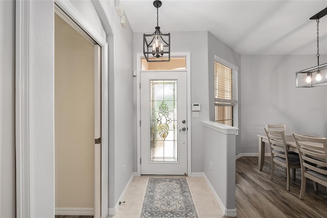 1748 SW 157th Place Rd, Ocala, FL 34473 - foyer entrance with a chandelier and baseboards