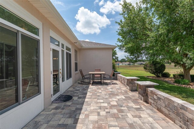 1748 SW 157th Place Rd, Ocala, FL 34473 - view of patio / terrace featuring outdoor dining area
