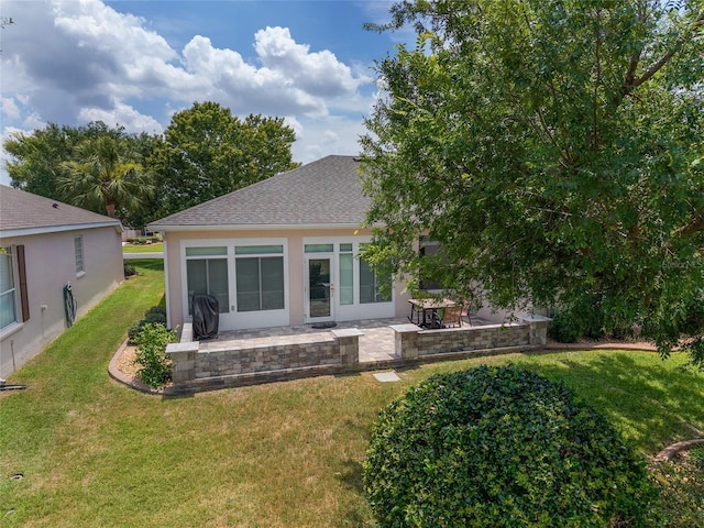1748 SW 157th Place Rd, Ocala, FL 34473 - rear view of house with a patio area, a yard, roof with shingles, and stucco siding