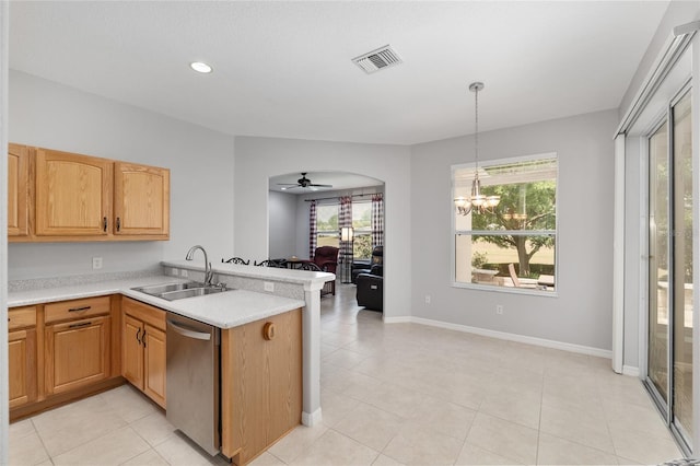 1748 SW 157th Place Rd, Ocala, FL 34473 - kitchen with stainless steel dishwasher, a sink, a peninsula, light countertops, and a chandelier