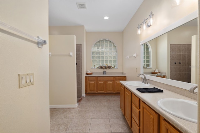 1748 SW 157th Place Rd, Ocala, FL 34473 - full bath with a walk in shower, double vanity, tile patterned floors, recessed lighting, and baseboards