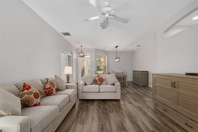 1748 SW 157th Place Rd, Ocala, FL 34473 - living room with dark wood-style flooring, ceiling fan, and baseboards