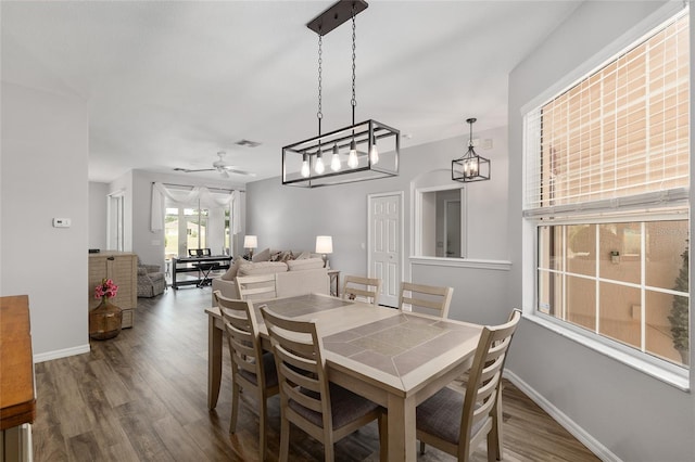 1748 SW 157th Place Rd, Ocala, FL 34473 - dining area featuring wood finished floors, a ceiling fan, and baseboards