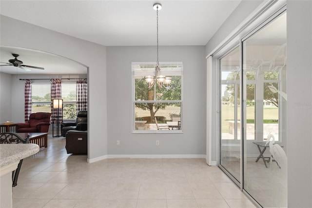 1748 SW 157th Place Rd, Ocala, FL 34473 - dining space with a ceiling fan, baseboards, a chandelier, and light tile patterned floors