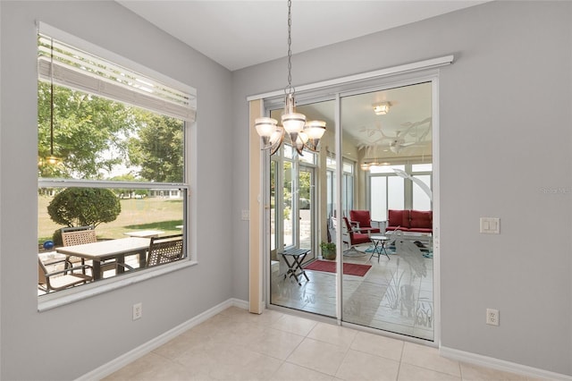 1748 SW 157th Place Rd, Ocala, FL 34473 - tiled dining area with baseboards and a chandelier
