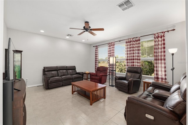 1748 SW 157th Place Rd, Ocala, FL 34473 - living area with a ceiling fan, light tile patterned floors, and baseboards