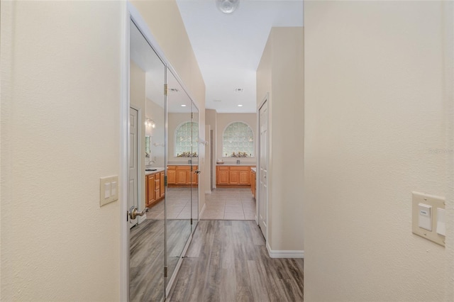 1748 SW 157th Place Rd, Ocala, FL 34473 - corridor featuring light wood-style floors and baseboards