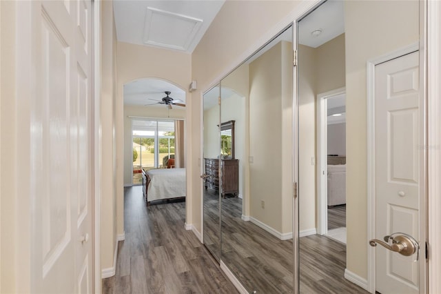 1748 SW 157th Place Rd, Ocala, FL 34473 - corridor with dark wood finished floors, baseboards, and attic access