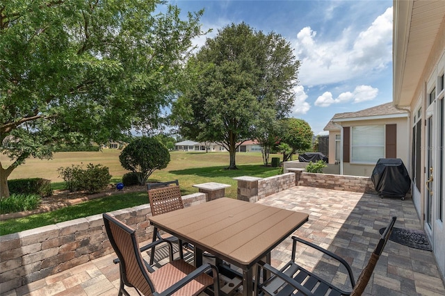 1748 SW 157th Place Rd, Ocala, FL 34473 - view of patio / terrace with outdoor dining area and a grill