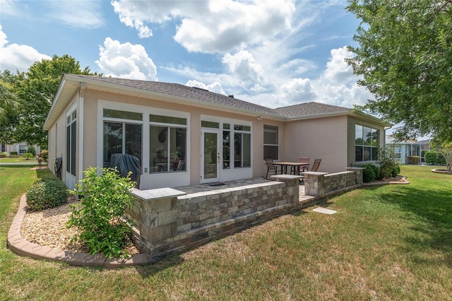 1748 SW 157th Place Rd, Ocala, FL 34473 - back of house featuring stucco siding, a lawn, and a patio