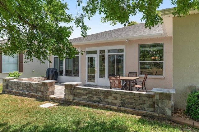 1748 SW 157th Place Rd, Ocala, FL 34473 - rear view of house with a patio, stucco siding, and roof with shingles