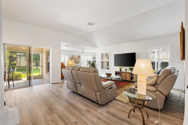 3141 Roswell Rd, The Villages, FL 32162 - living room featuring light wood-style floors, vaulted ceiling, and a ceiling fan