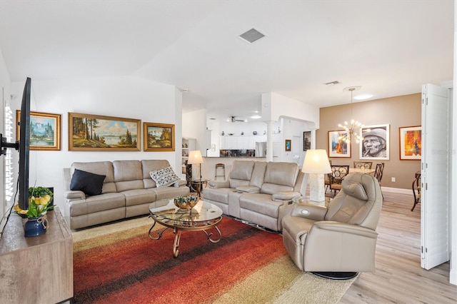 3141 Roswell Rd, The Villages, FL 32162 - living area featuring light wood-style floors, a chandelier, baseboards, and a ceiling fan