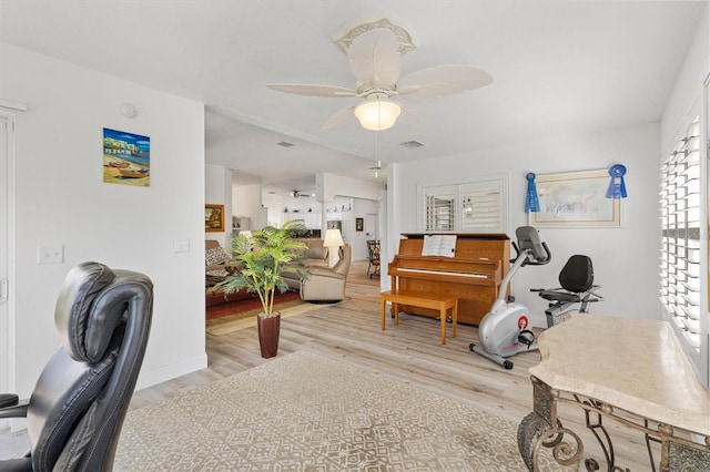 3141 Roswell Rd, The Villages, FL 32162 - home office featuring wood finished floors, a ceiling fan, and baseboards