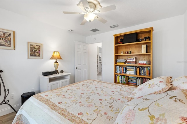 3141 Roswell Rd, The Villages, FL 32162 - bedroom featuring wood finished floors, baseboards, and a ceiling fan