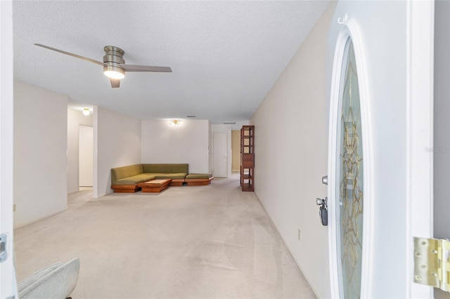 8885 SW 90th Ave, Ocala, FL 34481 - living area with light carpet, ceiling fan, and a textured ceiling