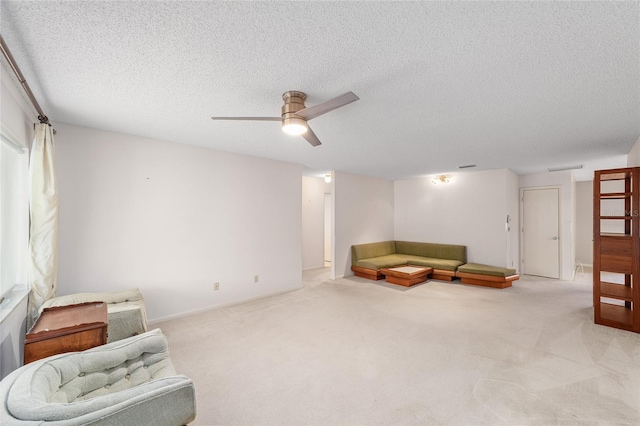 8885 SW 90th Ave, Ocala, FL 34481 - living area featuring carpet floors, ceiling fan, and a textured ceiling