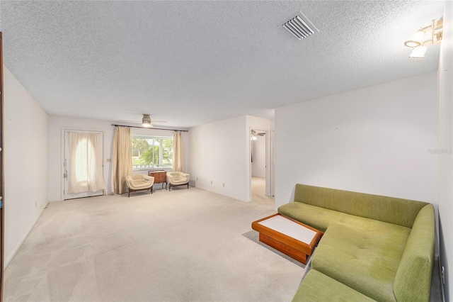 8885 SW 90th Ave, Ocala, FL 34481 - living area featuring carpet floors and a textured ceiling